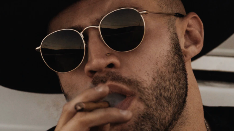 man smokes cigar